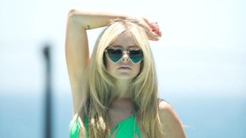 Avril Lavigne sets the temperature in skimpy halter neck green bikini