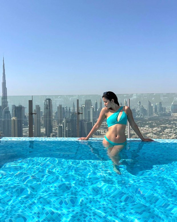 Shanaya Kapoor is a smokeshow in an aqua cut-out one-shoulder bikini while soaking in the sun in Dubai