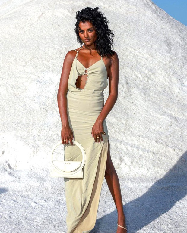 Bridgerton star Simone Ashley steals the show at the Jacquemus fall 2022 show in a mint green dress with a thigh-high split and a Rs. 55k Jacquemus circle bag.