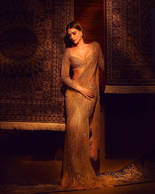 Kriti Sanon glows in a Falguni & Shane peacock’s shimmering sequin golden saree for Umang 2022