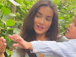Amy Jackson and her son play with a butterfly