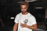 Aayush Sharma smiles for paps in white tshirt and beanie