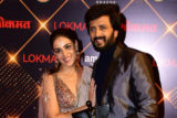 Riteish Deshmukh and Genelia D’souza walk hand in hand at the Lokmat Awards