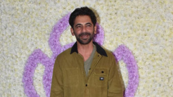 Sunil Grover smiles for paps in a green outfit