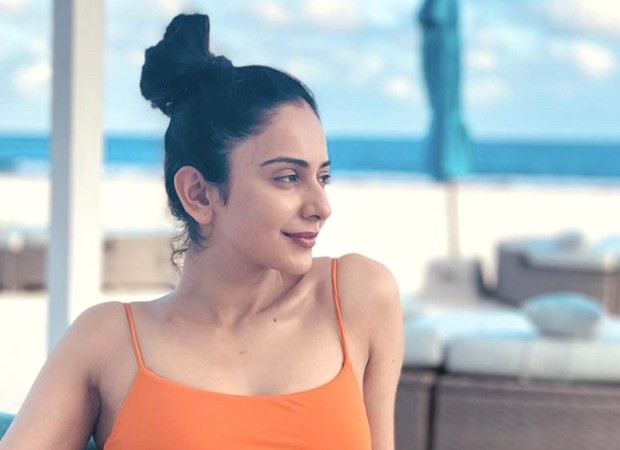 Rakul Preet Singh says, "Thank God for a holiday" as she relaxes on the beach in the Maldives while wearing an orange swimsuit : Bollywood News - Vimarsana News